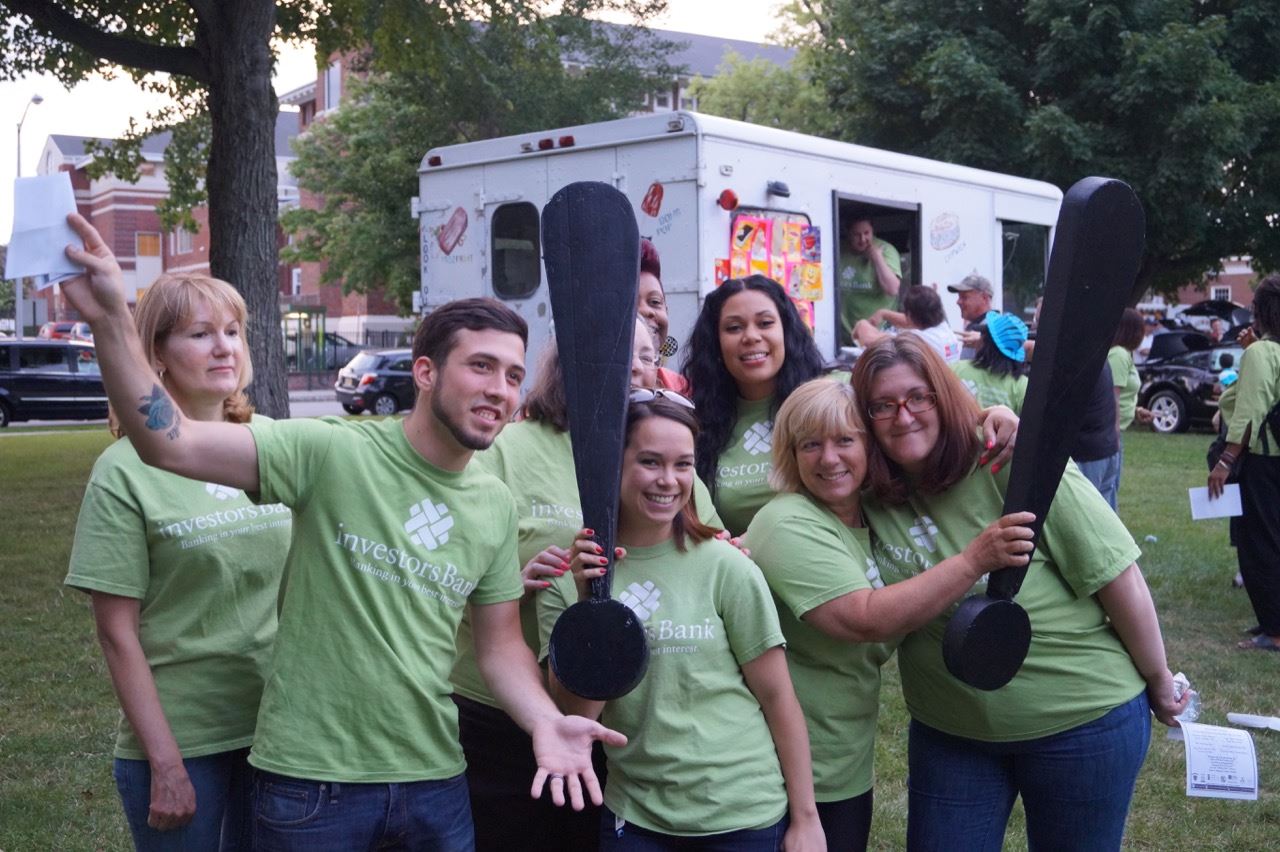 Investors Bank representatives pose with the Share the Fun exclamation points.
